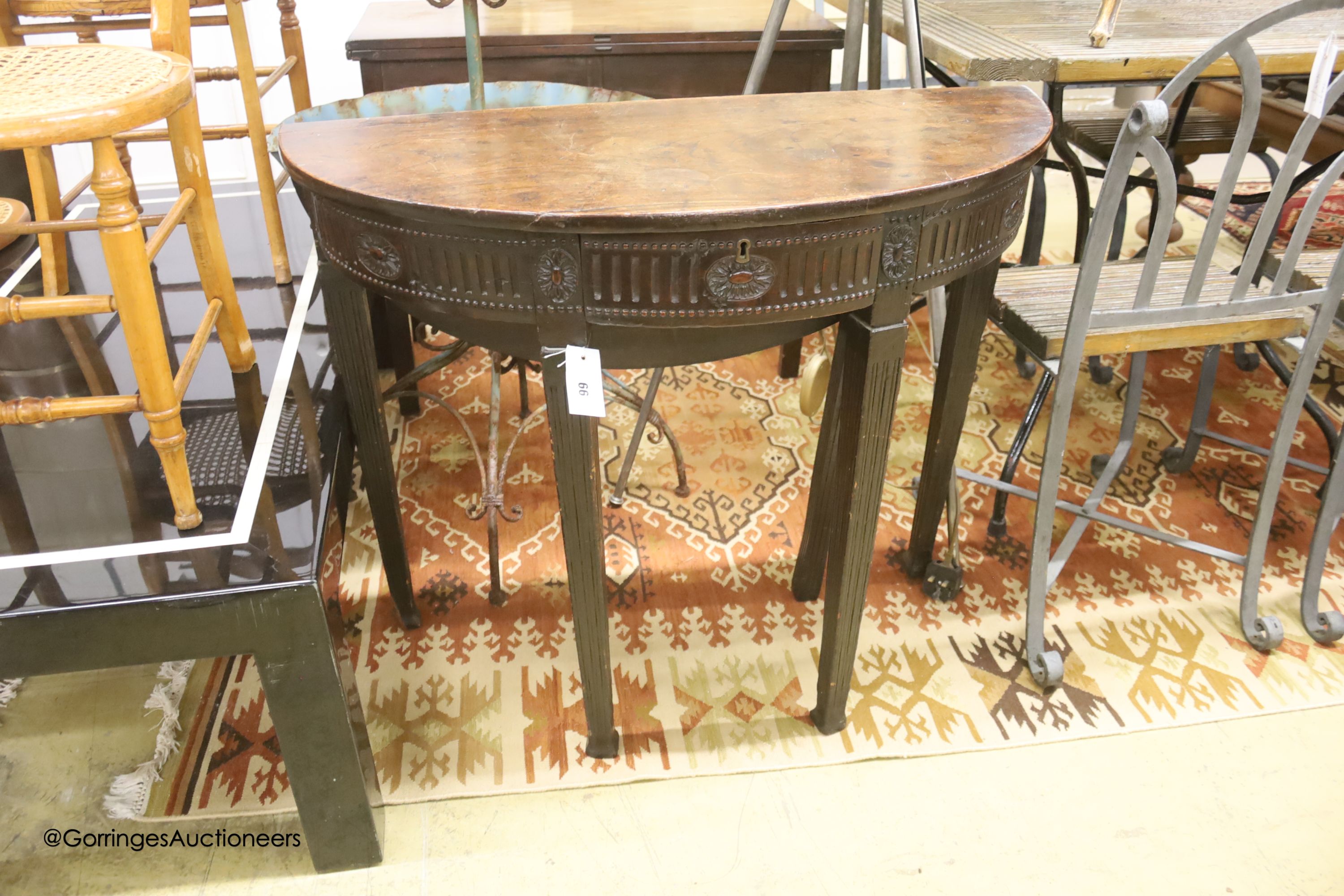 A George III mahogany 'D' shaped drop flap tea table, fitted with one drawer, width 88cm, depth 36cm, height 74cm